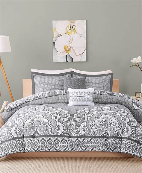 A heathered texture is printed throughout varying weights of striping in navy blue, grey and white with pops of light blue. . Macys twin xl comforter